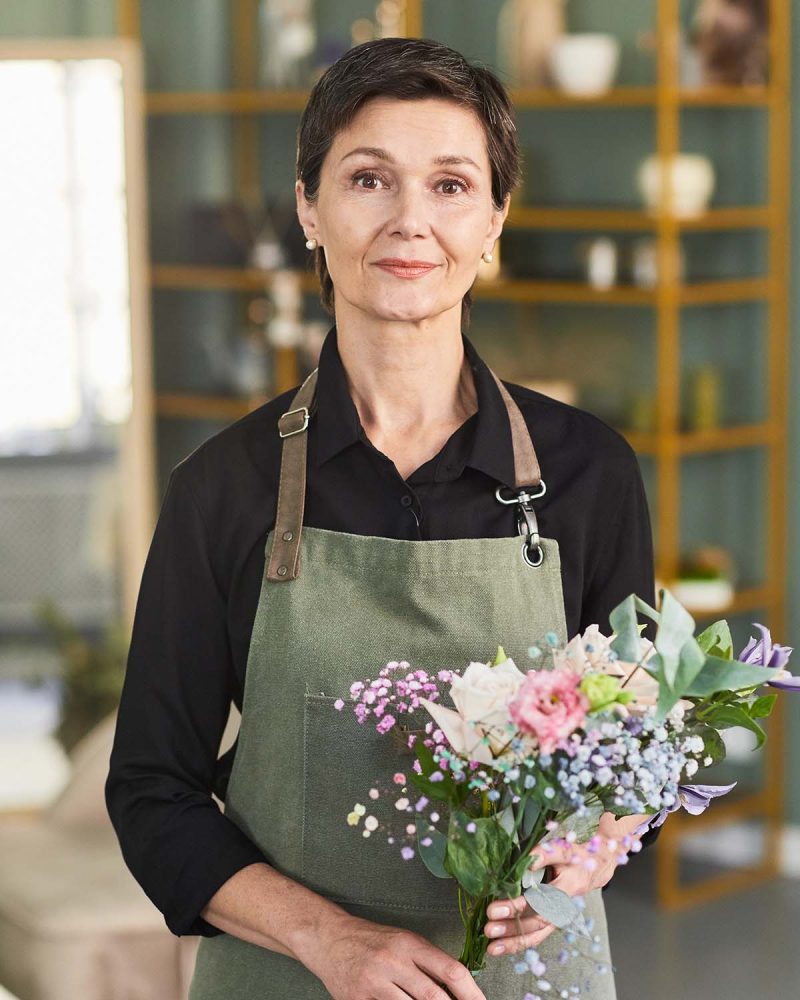 mature-female-florist-smiling-25LPD2M.jpg